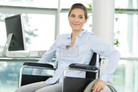disabled person in the wheelchair works in the office