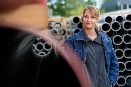portrait of female worker in building materials yard