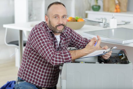 lost plumber with clipboard near washing machine
