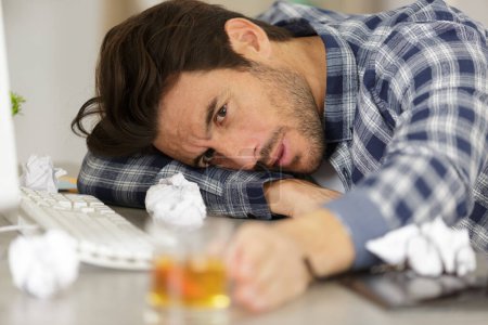 stressed office worker drunk while working