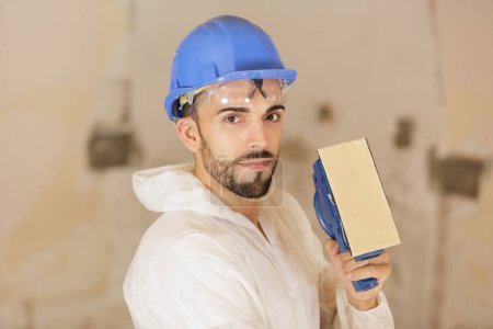 builder looking at the camera