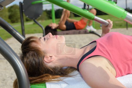 two women outdoor strength activity