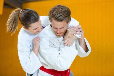 man and woman during karate training