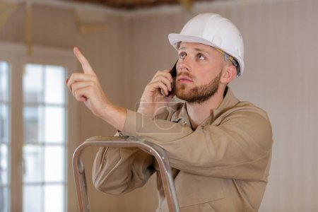 a male architect using walkie-talkie