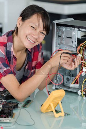 happy female pc worker smiling at camera