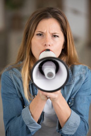 front view of woman speaking through a megaphone