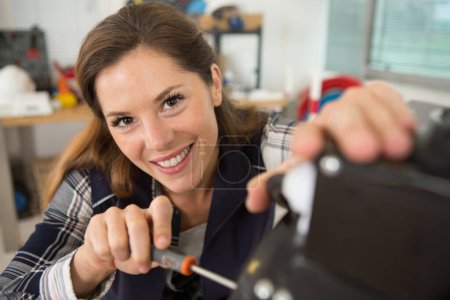 woman fixing a printer