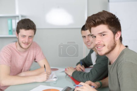 three students in a team have a presentation