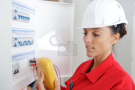 woman using an electric meter