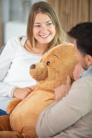 couple with a teddy bear