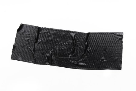 Foto de Un pedazo de vinilo de propósito general cinta negra aislada en blanco - Imagen libre de derechos