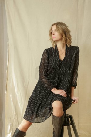 Photo for Serie of studio photos of young female model in black patterned dress in boho style - Royalty Free Image