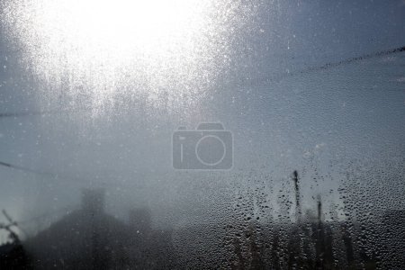 Photo for Closeup of heavy water condensation on window glass during a winter morning. - Royalty Free Image