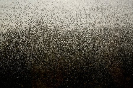Photo for Closeup of heavy water condensation on window glass during a winter morning. - Royalty Free Image