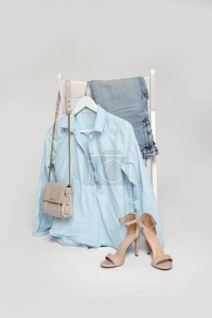 Photo for Clothes on a chair. Product photography, fashion still life. Spring summer outfits. - Royalty Free Image