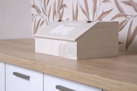 wooden bread box on the kitchen counter