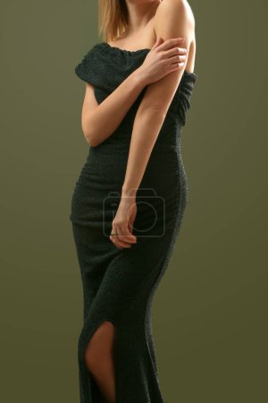 Serie of studio photos of female model in elegant black sparkling one shoulder asymmetric dress