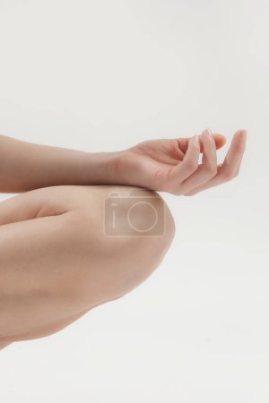 Photo for Close up of woman's fingers, meditating in a lotus yoga position - Royalty Free Image