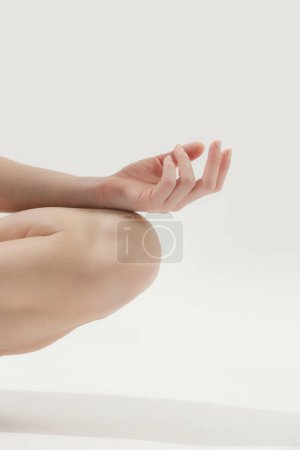 Photo for Close up of woman's fingers, meditating in a lotus yoga position - Royalty Free Image