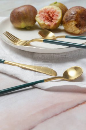 Photo for Creative shot of golden cutlery on marble table, Design concept. Modern kitchen. Scandinavian style tableware. - Royalty Free Image
