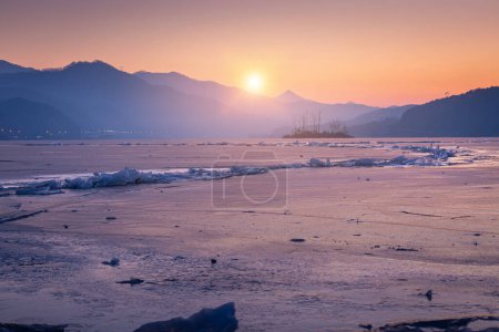 Photo for Frozen lake in South Korea in winter in sunrise at Dumulmeori, Yangpyeong, South Korea. - Royalty Free Image