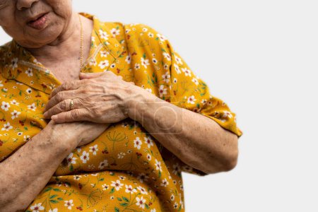 Photo for Elderly woman feels pain in her chest. Senior female Asian suffering from bad pain in his chest heart attack. Concept of emergency health care and affected by Cardiopulmonary Resuscitation. - Royalty Free Image
