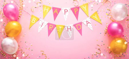 Party background with Happy birthday flags and colorful balloons and confetti, top view with copy space