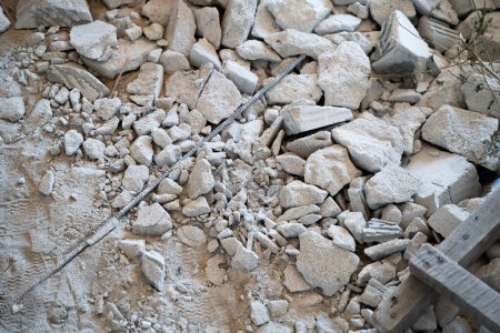 Photo for Broken aerated concrete at a construction site. Construction debris after the dismantling of the walls from the gas block. Construction industry waste - Royalty Free Image