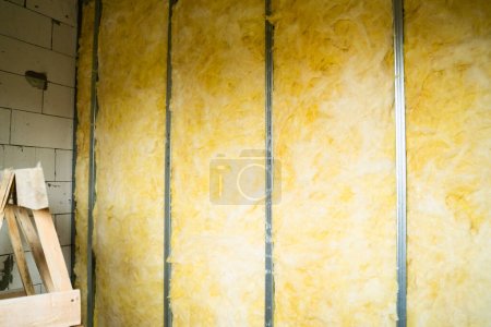 Photo for The frame interior partition is filled with mineral glass wool. Insulation and sound insulation - Royalty Free Image