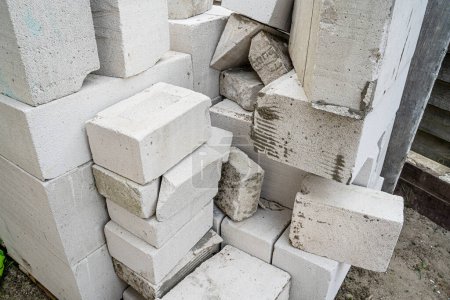 Photo for Scraps and pieces of aerated concrete blocks, close-up. Residues and waste from the construction industry - Royalty Free Image