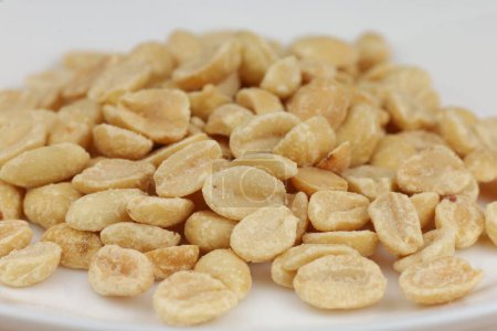 Close-up shot of salted peanuts, great for snack or culinary uses.