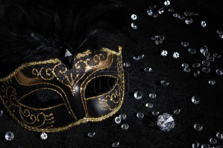 Photo for Close-up view of Carnival gold mask with diamonds on black background. - Royalty Free Image