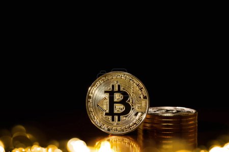 Photo for Bitcoin cryptocurrency with colorfull blurred bokeh on black background. - Royalty Free Image