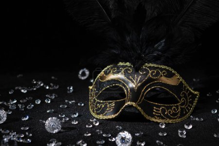 Photo for Carnival gold mask with diamonds on black background. - Royalty Free Image