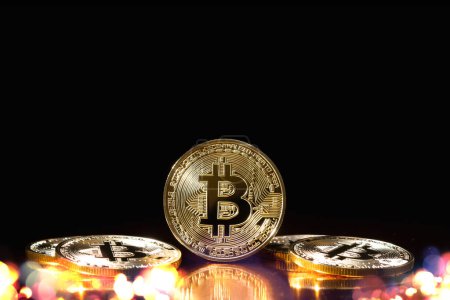 Photo for Bitcoin cryptocurrency with colorfull blurred bokeh on black background. - Royalty Free Image