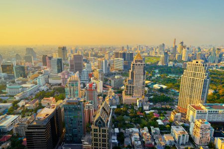 Photo for Sunset in megapolis. Beautiful cityscape with top view on skyscrapers. Bangkok, Thailand. - Royalty Free Image