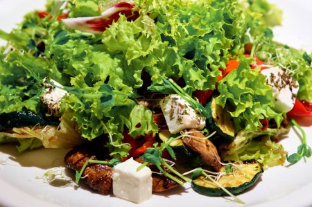 Photo for Close up of salad with grilled meat and vegetables and fetta cheese - Royalty Free Image