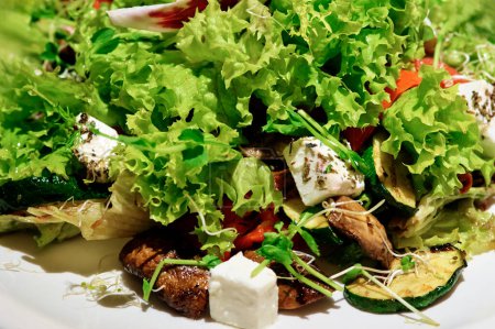 Photo for Close up of salad with grilled meat and vegetables and fetta cheese - Royalty Free Image