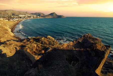 Photo for Sunset sea view on the rock coast and blue lagoon - Royalty Free Image