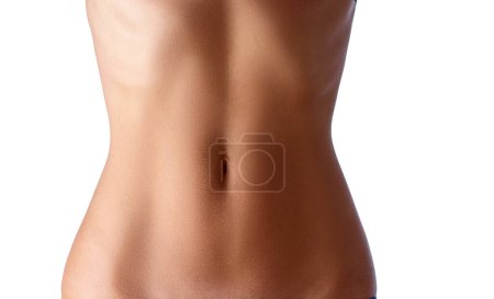 Photo for Close up of slim young woman belly isolated on white. - Royalty Free Image