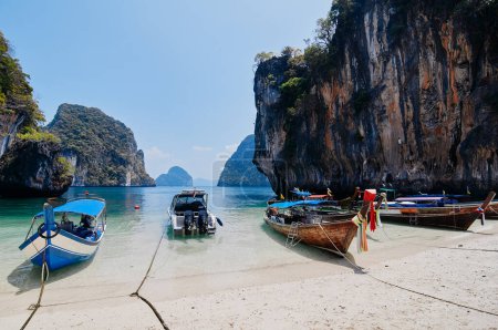 Photo for Beautiful landscape with traditional longtail boats, rocks, cliffs, tropical beach. Krabi, Thailand. - Royalty Free Image