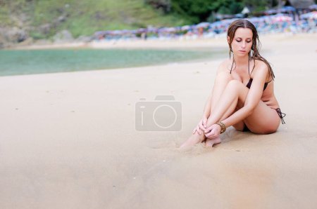 Photo for Vacation on the sea. Happy young woman enjoying suntan on the sand beach. - Royalty Free Image