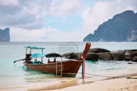 Photo for Travel by Thailand. Landscape with traditional longtail fishing and tourists boat on the sea beach. - Royalty Free Image