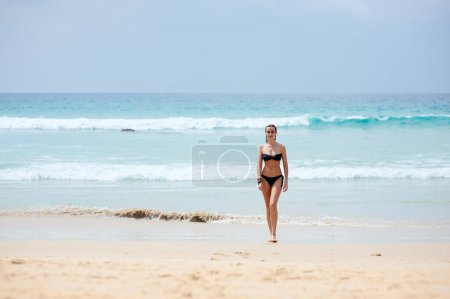 Photo for Vacation on the sea. Happy young woman on the sand beach. - Royalty Free Image