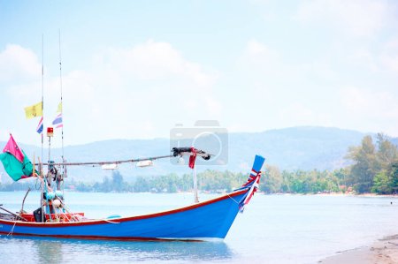 Photo for Travel by Thailand. Landscape with traditional longtail fishing boat on the sea surface. - Royalty Free Image