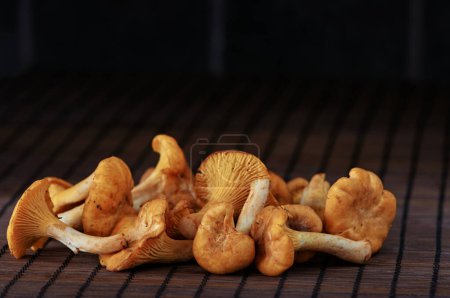 Photo for Vegetarian cuisine. Chanterelle mushrooms on the table. - Royalty Free Image