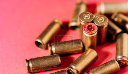 Photo for Casings and cartridges on red background. - Royalty Free Image