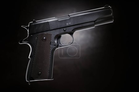 Photo for Colt 1911 pistol on the black background. - Royalty Free Image