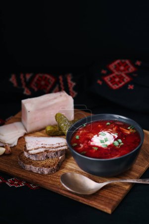 Photo for Traditional ukrainian cuisine. Bowl with tasty red borscht soup. - Royalty Free Image