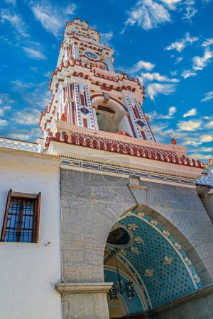 Téléchargez les photos : Bell tower of the Monastery of St. Archangel Michael of Panormitis.Greek Orthodox monastery dedicated to Archangel Michael on the Greek island of Symi in the Dodecanese archipelago.Built around 450 AD - en image libre de droit